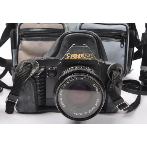 266 - Canon - A late 20th century 1980s Canon T70 35mm SLR camera with Hanimex Pro 550 electronic flash an... 