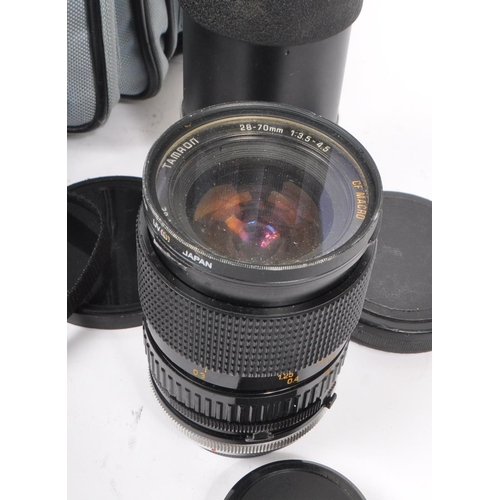 266 - Canon - A late 20th century 1980s Canon T70 35mm SLR camera with Hanimex Pro 550 electronic flash an... 