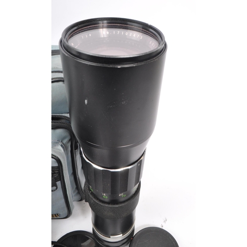 266 - Canon - A late 20th century 1980s Canon T70 35mm SLR camera with Hanimex Pro 550 electronic flash an... 