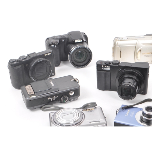 269 - A collection of contemporary digital compact mirrorless and point and shoot cameras. The collection ... 