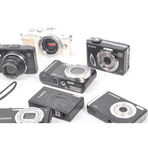 269 - A collection of contemporary digital compact mirrorless and point and shoot cameras. The collection ... 