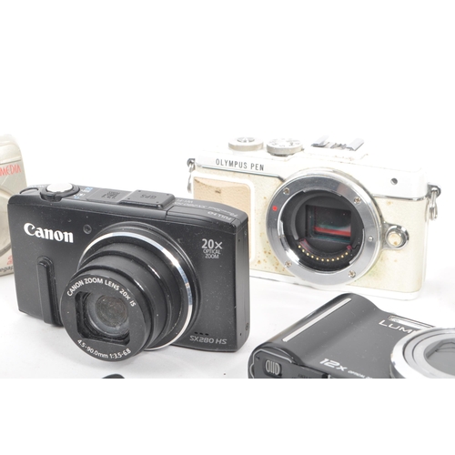 269 - A collection of contemporary digital compact mirrorless and point and shoot cameras. The collection ... 