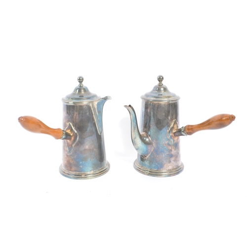 275 - Roberts & Belk Ltd - A pair of early 20th Century silver plated coffee / hot chocolate pots having w... 