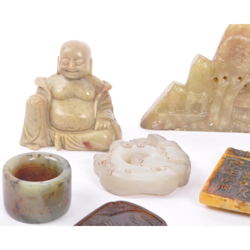 277 - A collection of fifteen Chinese jade and soapstone curios. The collection to include a carved Buddha... 