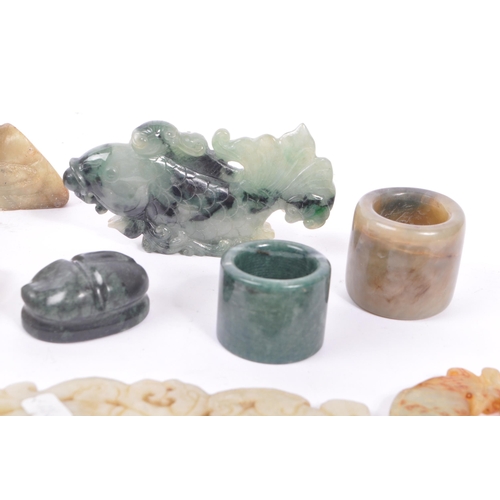 277 - A collection of fifteen Chinese jade and soapstone curios. The collection to include a carved Buddha... 