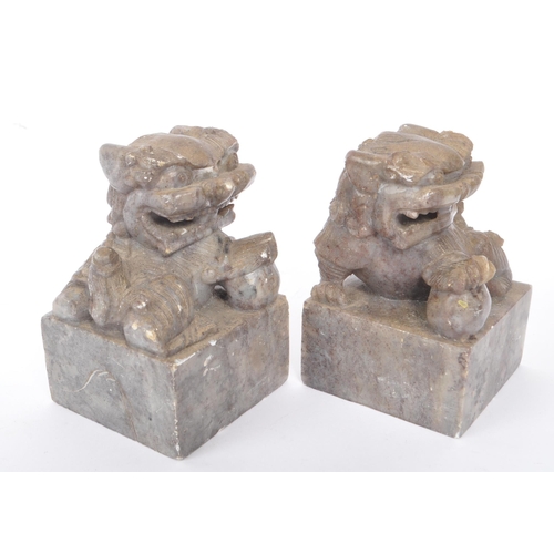278 - Two 20th century Chinese granite foo dogs / lion figures alongside two bronze seals. The foo dogs ca... 
