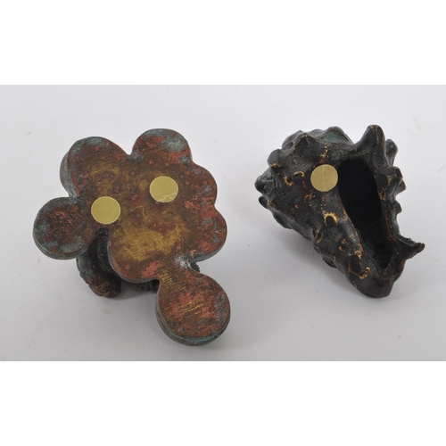 280 - A collection of 20th century Chinese bronze and brass curios. The collection to include a small cloi... 