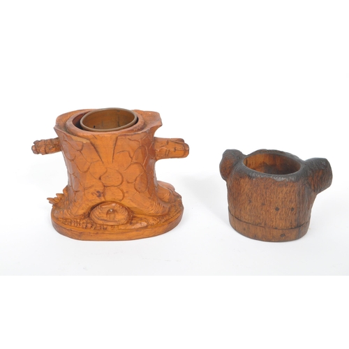 285 - A collection of wooden items to include a black forest candle holder in the form of a dog's head wit... 