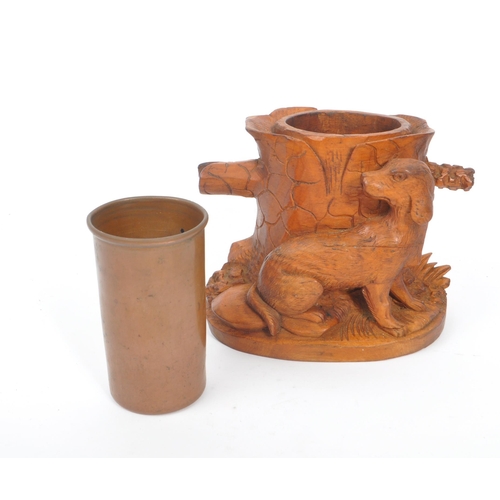 285 - A collection of wooden items to include a black forest candle holder in the form of a dog's head wit... 