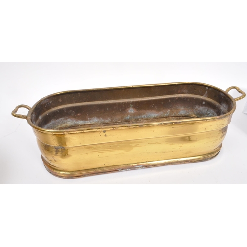 288 - A late 19th Century Victorian brass planter of ovoid form with twin handles to either side with roun... 