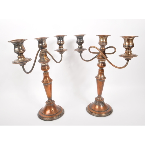 293 - A 20th Century claret jug having cut glass body and silver plated top with flourishes to handle. Tog... 