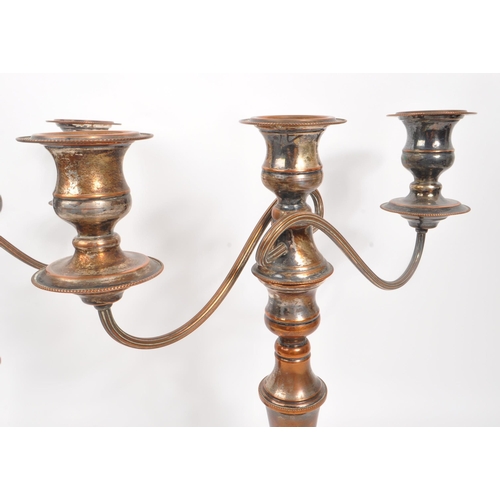 293 - A 20th Century claret jug having cut glass body and silver plated top with flourishes to handle. Tog... 