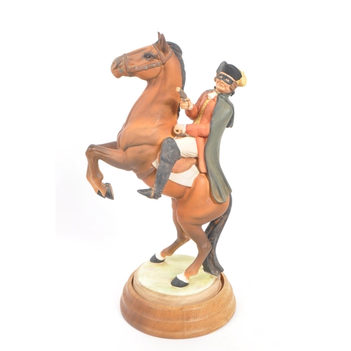 3 - Beswick - Highwayman - A porcelain hand painted china statue of a man figure on a rearing horse. On ... 