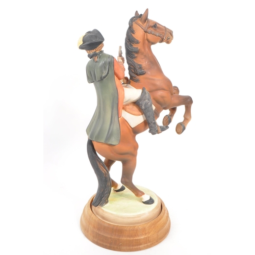 3 - Beswick - Highwayman - A porcelain hand painted china statue of a man figure on a rearing horse. On ... 