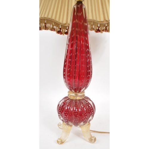 32 - A vintage mid 20th century Murano studio art glass table lamp. The lamp raised on four twisted cabri... 