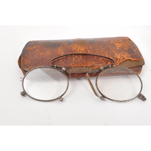 329 - A collection of early 20th century fashion accessories. The collection to include two pairs of eye g... 