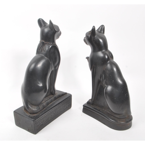 331 - A pair of 20th Century heavy black resin Egyptian Bastet ' sphynx ' cat figurines in seated position... 