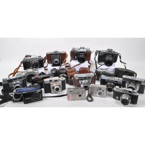 338 - A large collection of 20th century and contemporary cameras. The collection to include both film and... 