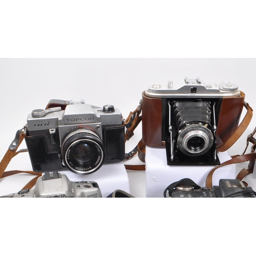 338 - A large collection of 20th century and contemporary cameras. The collection to include both film and... 