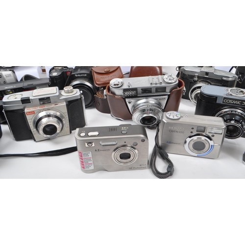 338 - A large collection of 20th century and contemporary cameras. The collection to include both film and... 