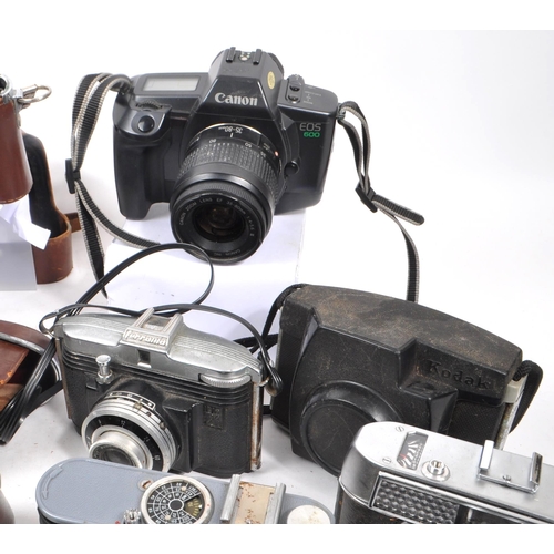 338 - A large collection of 20th century and contemporary cameras. The collection to include both film and... 