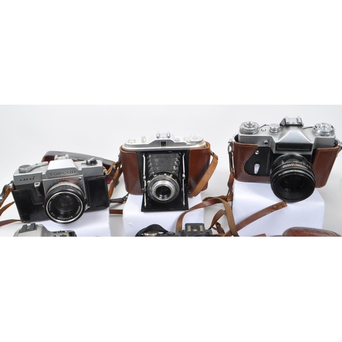 338 - A large collection of 20th century and contemporary cameras. The collection to include both film and... 