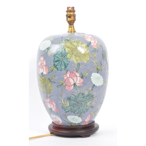 35 - An early 20th century Chinese converted urn vase table lamp. The lamp of urn form, raised on a later... 