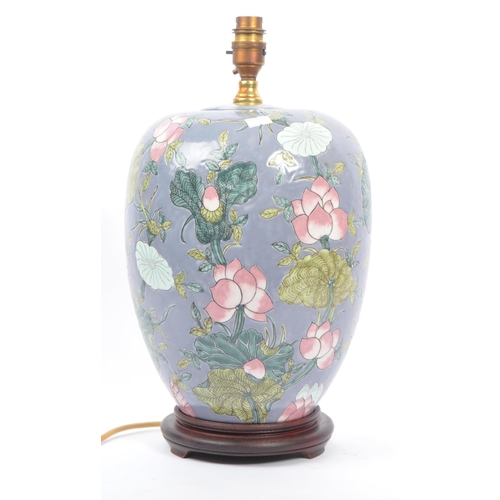 35 - An early 20th century Chinese converted urn vase table lamp. The lamp of urn form, raised on a later... 