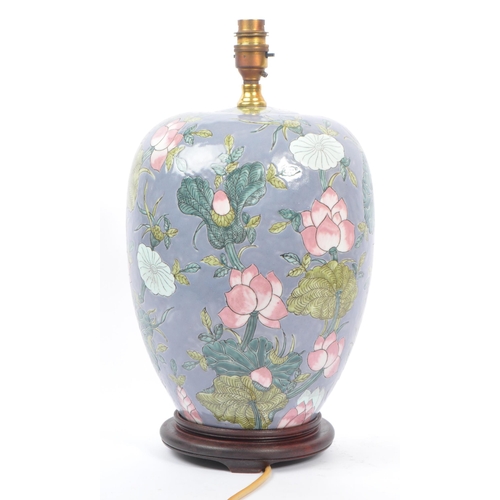 35 - An early 20th century Chinese converted urn vase table lamp. The lamp of urn form, raised on a later... 