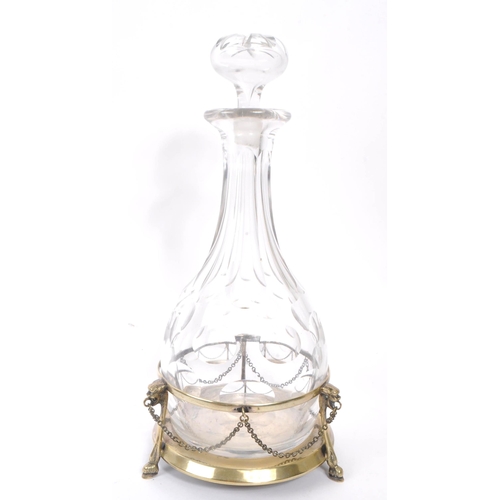 37 - A vintage 20th century faceted glass wine / brandy decanter. With a circular silver plate stand, wit... 