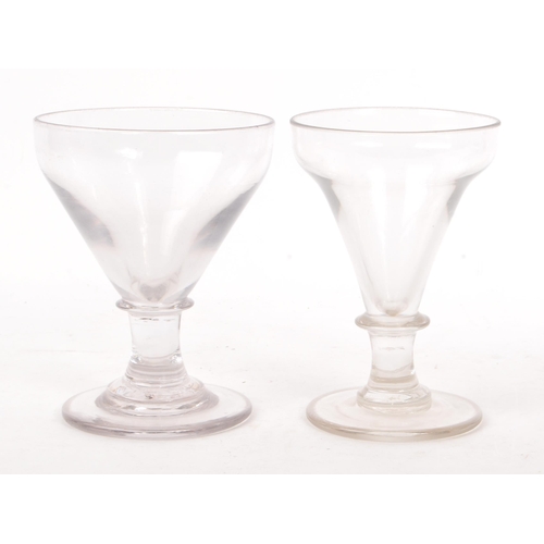 4 - Two George III 18th century glass drinking goblets / rummers. Ogee bow on knop stem with circular fo... 