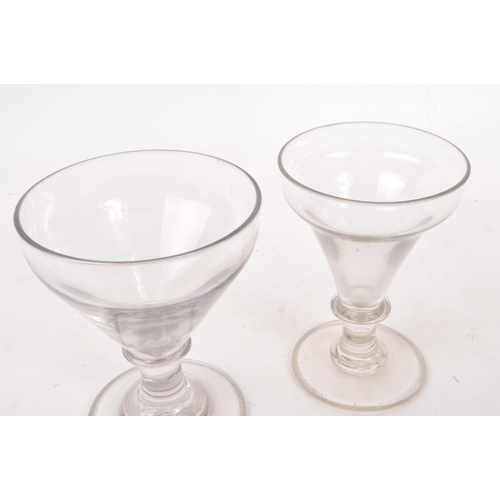 4 - Two George III 18th century glass drinking goblets / rummers. Ogee bow on knop stem with circular fo... 