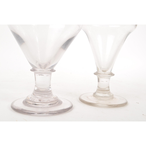 4 - Two George III 18th century glass drinking goblets / rummers. Ogee bow on knop stem with circular fo... 