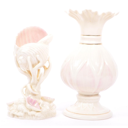 43 - Belleek - A 20th century Belleek Lotus vase, alongside a shell vase. The vase raised on a rounded ba... 