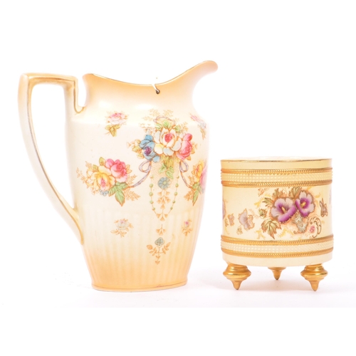 44 - S. F. & CO. - A late 19th century S. F. & Co. Crown Devon jug, alongside a small Jardinière planter ... 