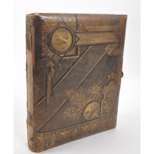 446 - A 19th Century Victorian leather bound musical photo album containing portrait photographs and carte... 