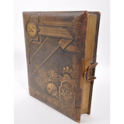 446 - A 19th Century Victorian leather bound musical photo album containing portrait photographs and carte... 