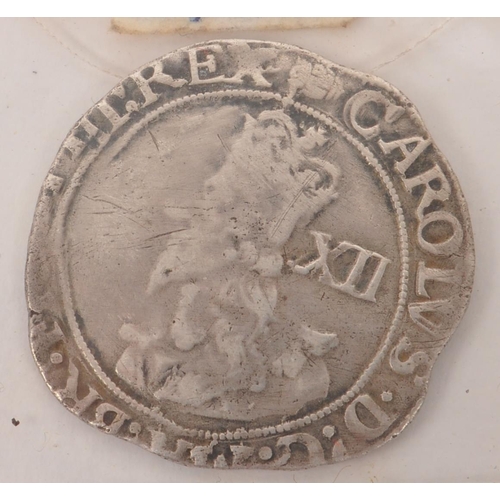 495 - A 17th century 1636-39 King Charles I silver shilling, alongside a King James II 1687 Fourpence coin... 