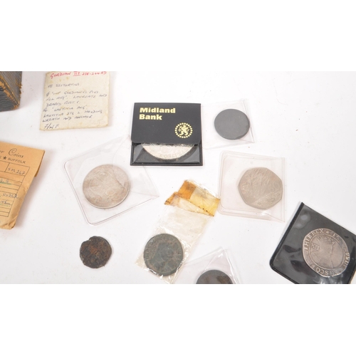 498 - A collection of James I and later British currency coins, alongside some Roman examples. The collect... 