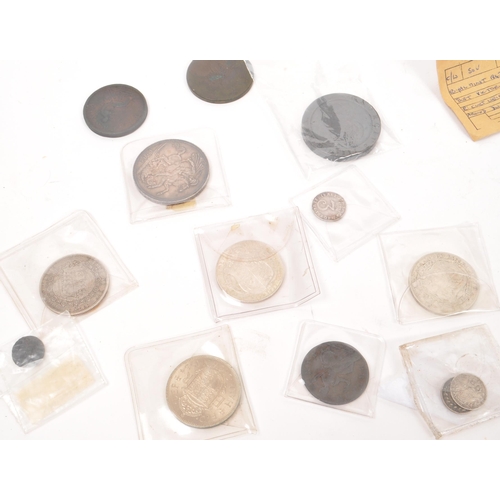 498 - A collection of James I and later British currency coins, alongside some Roman examples. The collect... 