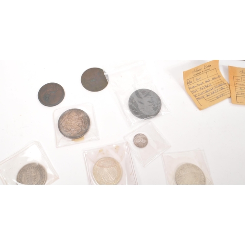 498 - A collection of James I and later British currency coins, alongside some Roman examples. The collect... 