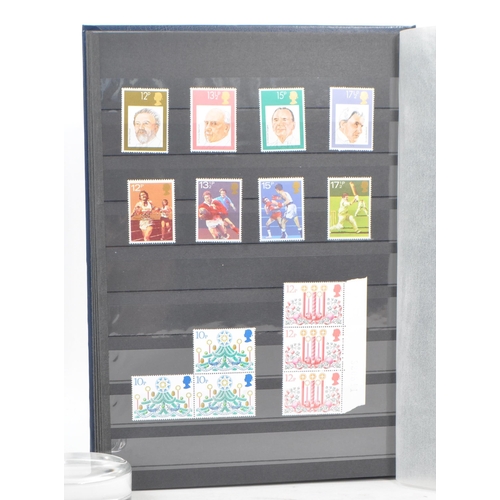 500 - Royal Mail - A collection of British Royal Mail commemorative stamps held unhinged within two stamp ... 