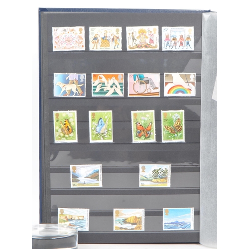 500 - Royal Mail - A collection of British Royal Mail commemorative stamps held unhinged within two stamp ... 