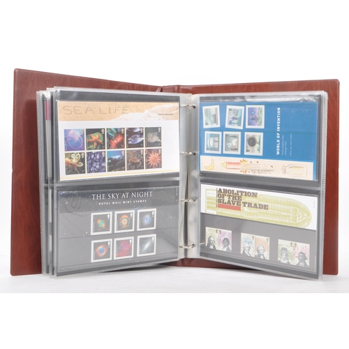 518 - Royal Mail - A large collection of British Royal Mail commemorative stamps presentation packs held w... 