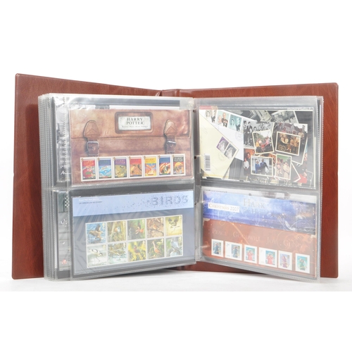 518 - Royal Mail - A large collection of British Royal Mail commemorative stamps presentation packs held w... 