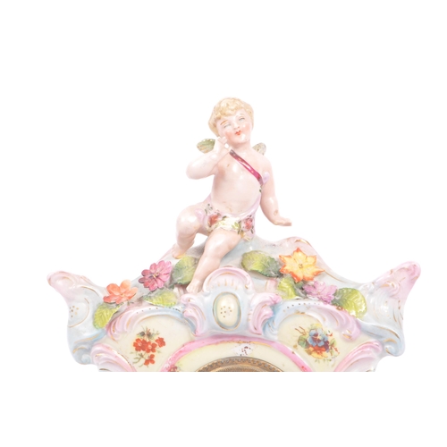 55 - An early 20th Century continental Meissen / Dresden style porcelain mantel clock having pastel pink ... 