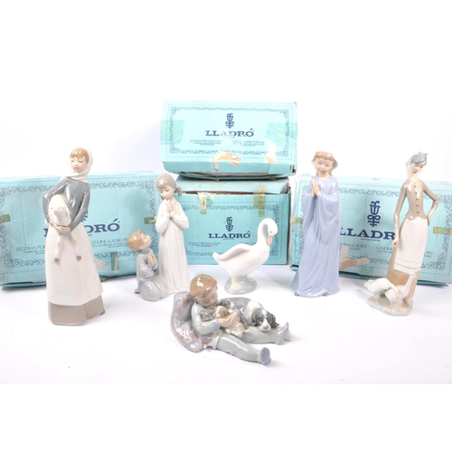 56 - Lladro / Nao - A collection of 20th century Lladro and Nao porcelain statues and figures. The collec... 