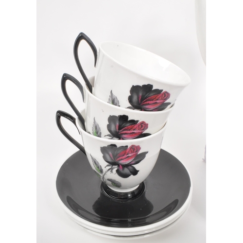 66 - Royal Albert - A 20th Century vintage bone china tea / coffee service in the black rose pattern havi... 