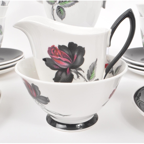 66 - Royal Albert - A 20th Century vintage bone china tea / coffee service in the black rose pattern havi... 