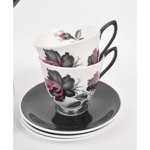 66 - Royal Albert - A 20th Century vintage bone china tea / coffee service in the black rose pattern havi... 